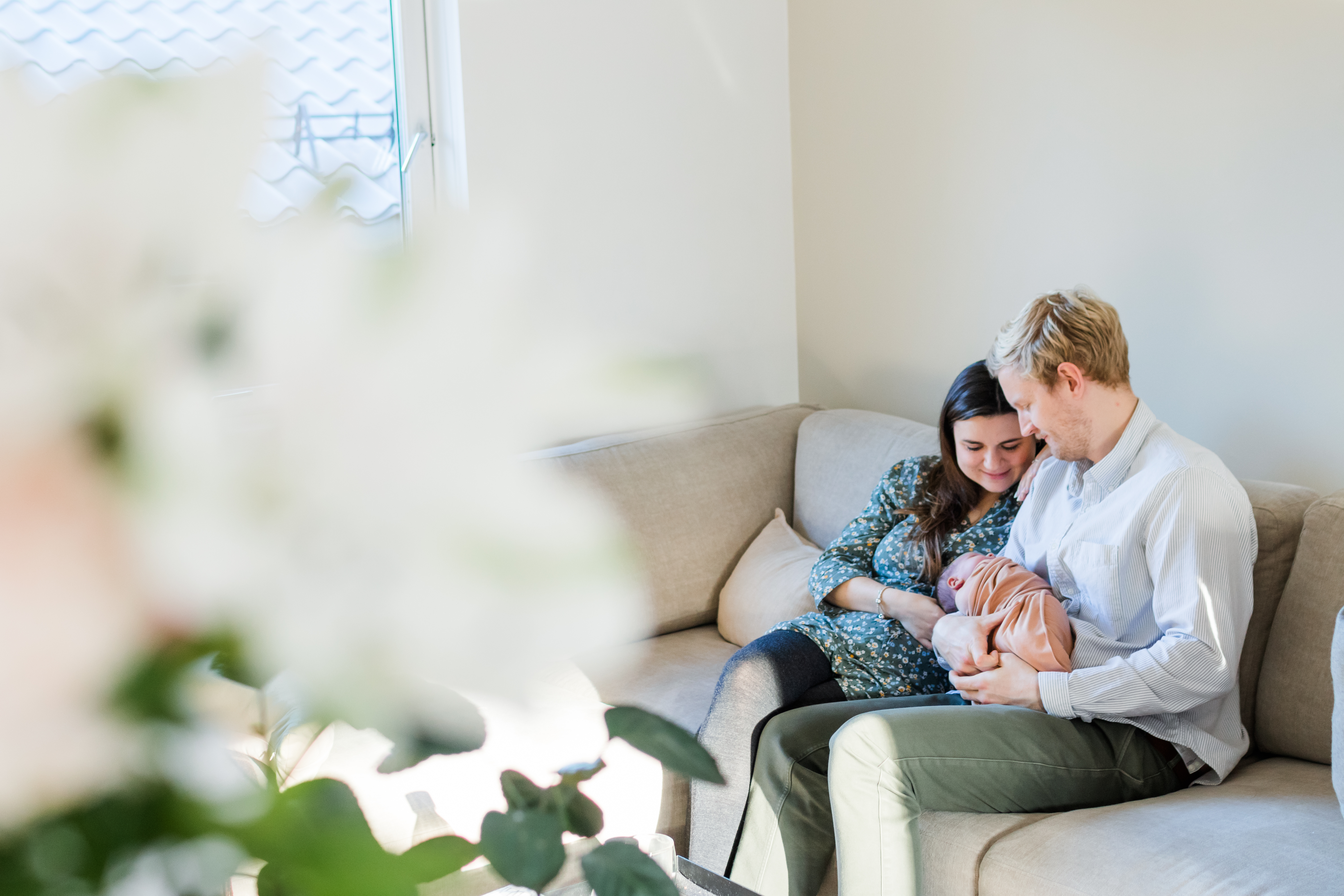 Family snuggled on cough