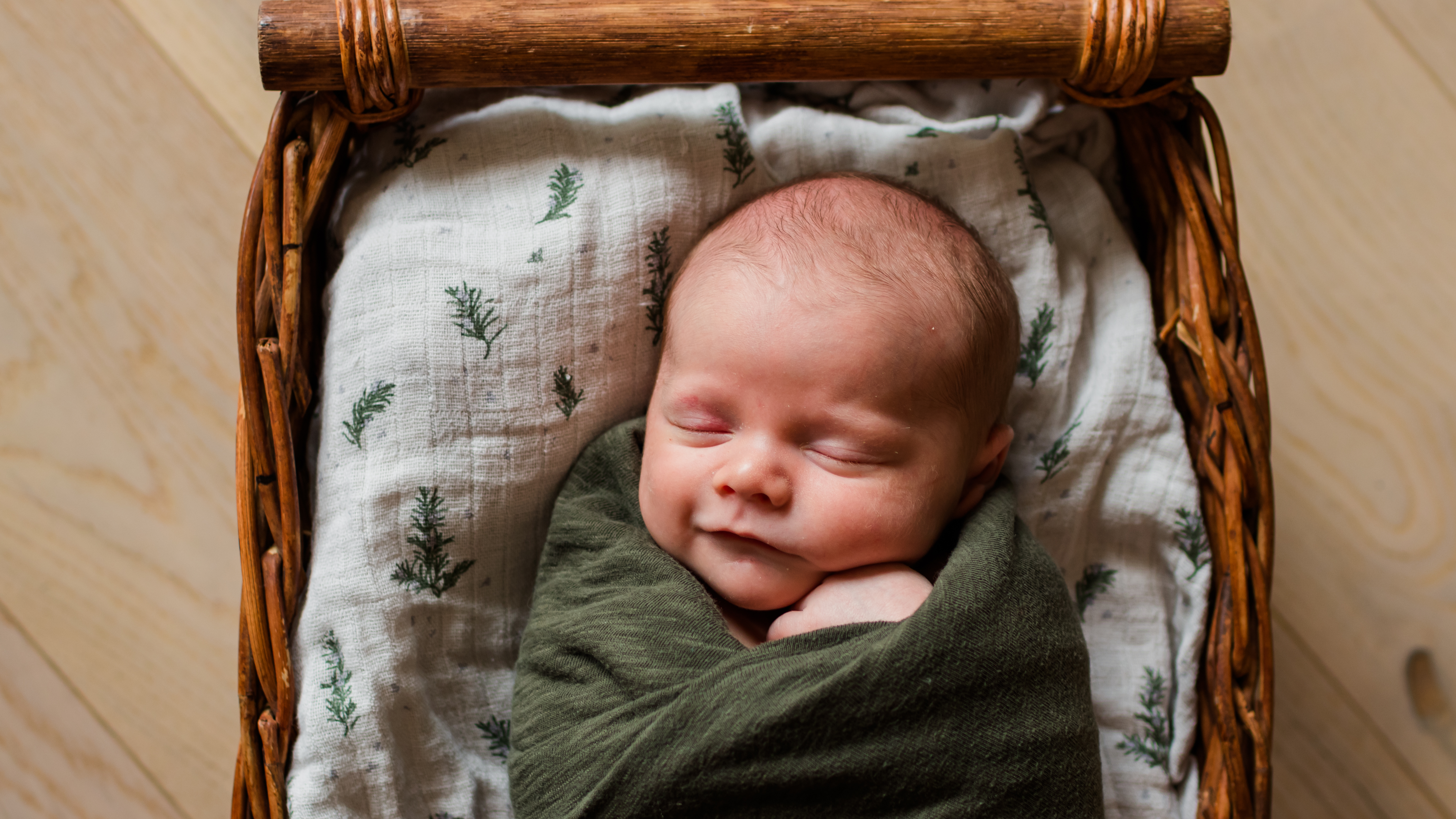 Baby swaddled in basket, newborn photographer in southern Colorado